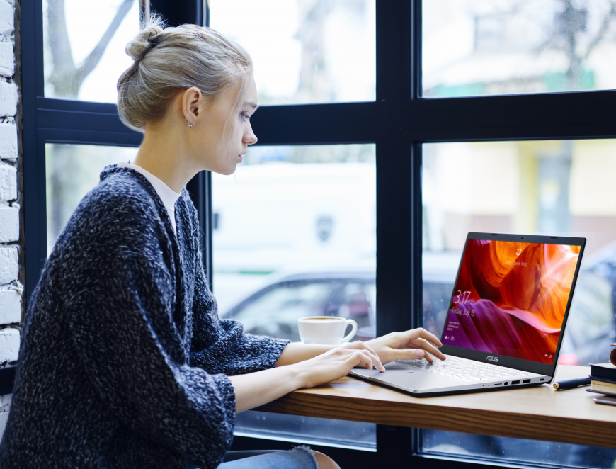 Woman typing on laptop